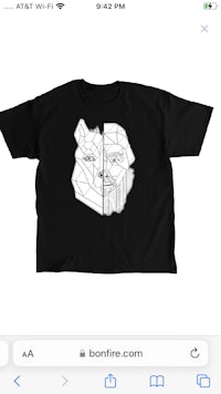 a black t - shirt with an image of a dog on it